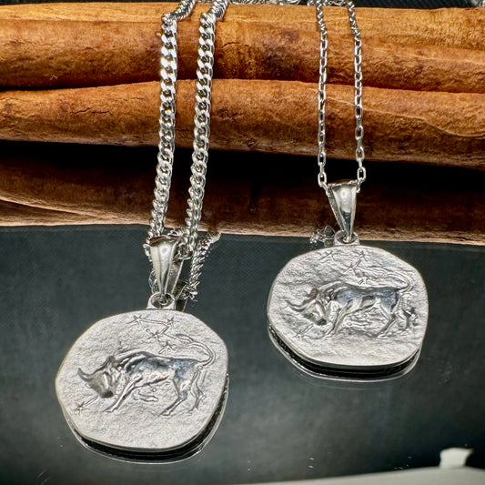Silver bull pendant necklace, perfect for men or women, featuring a unique animal design on a stylish chain.