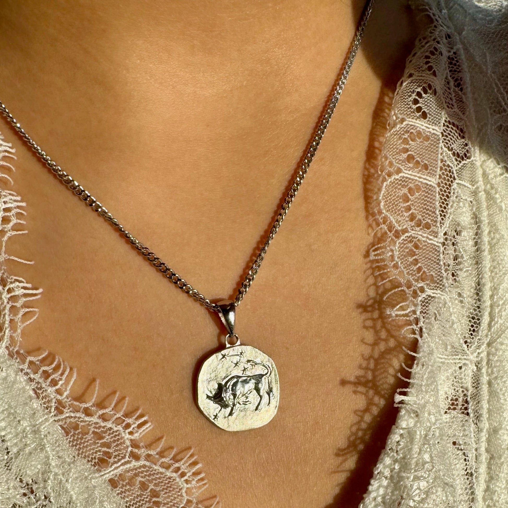 Silver Taurus zodiac pendant necklace, perfect for women seeking a unique, minimalist accessory for casual or formal occasions.
