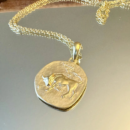 Elegant gold Taurus zodiac pendant necklace, perfect for women and men who appreciate minimalist astrology jewelry.