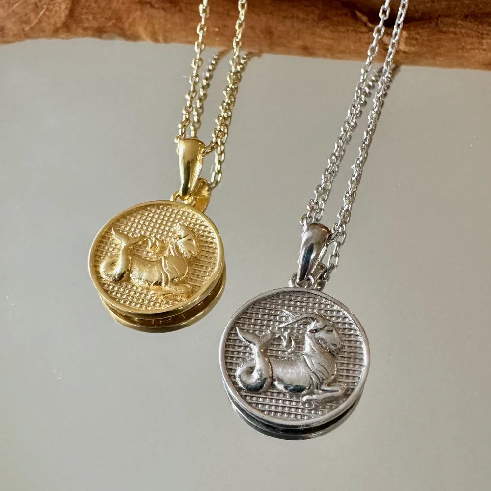 Gold and silver zodiac animal pendants on delicate chains, perfect for women and men seeking a vintage style.