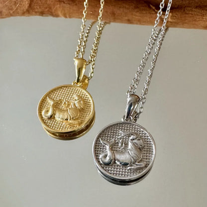 Gold and silver zodiac animal pendants on delicate chains, perfect for women and men seeking a vintage style.