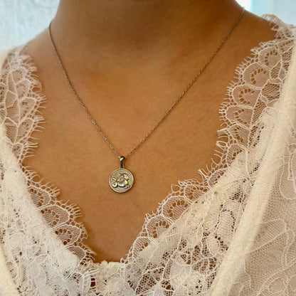 Delicate silver pendant necklace with floral design, perfect for women seeking minimalist, everyday elegance.