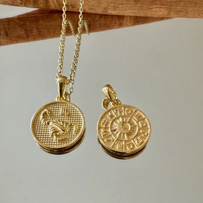 Gold zodiac sign pendants on delicate chains, perfect for women seeking unique, minimalist jewelry for everyday wear.