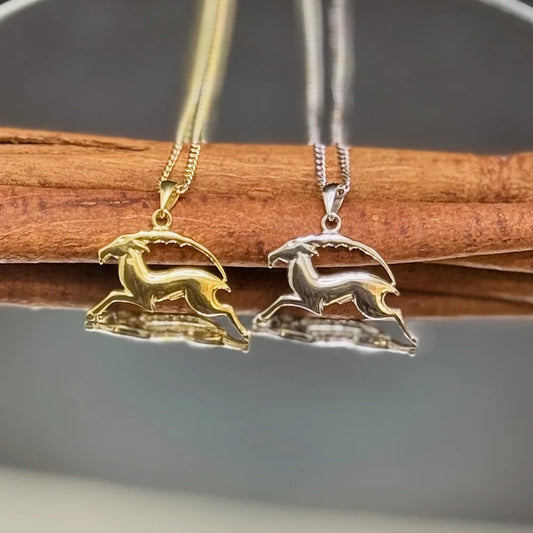 Elegant gold and silver deer pendants on a sleek chain, perfect for women seeking a minimalist, nature-inspired touch.