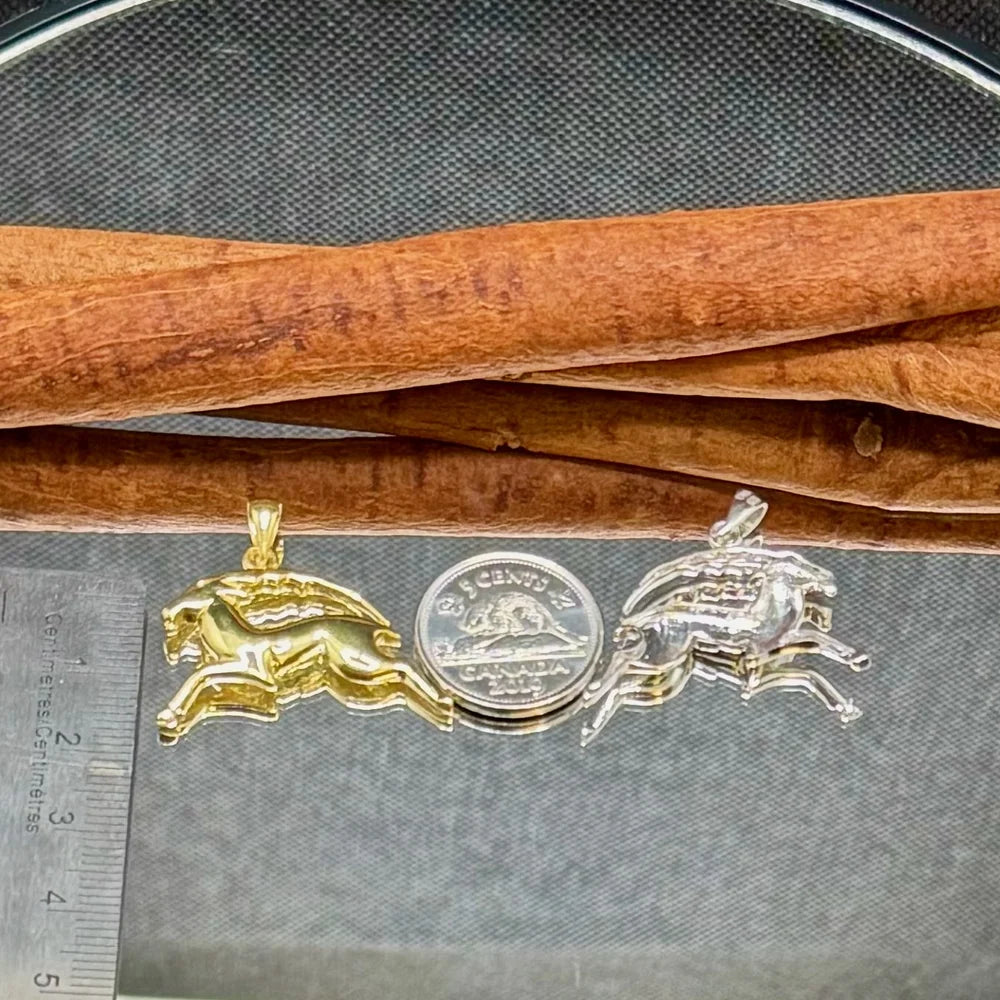 Gold and silver galloping horse pendants, perfect for stylish men and women who love unique, vintage jewelry.