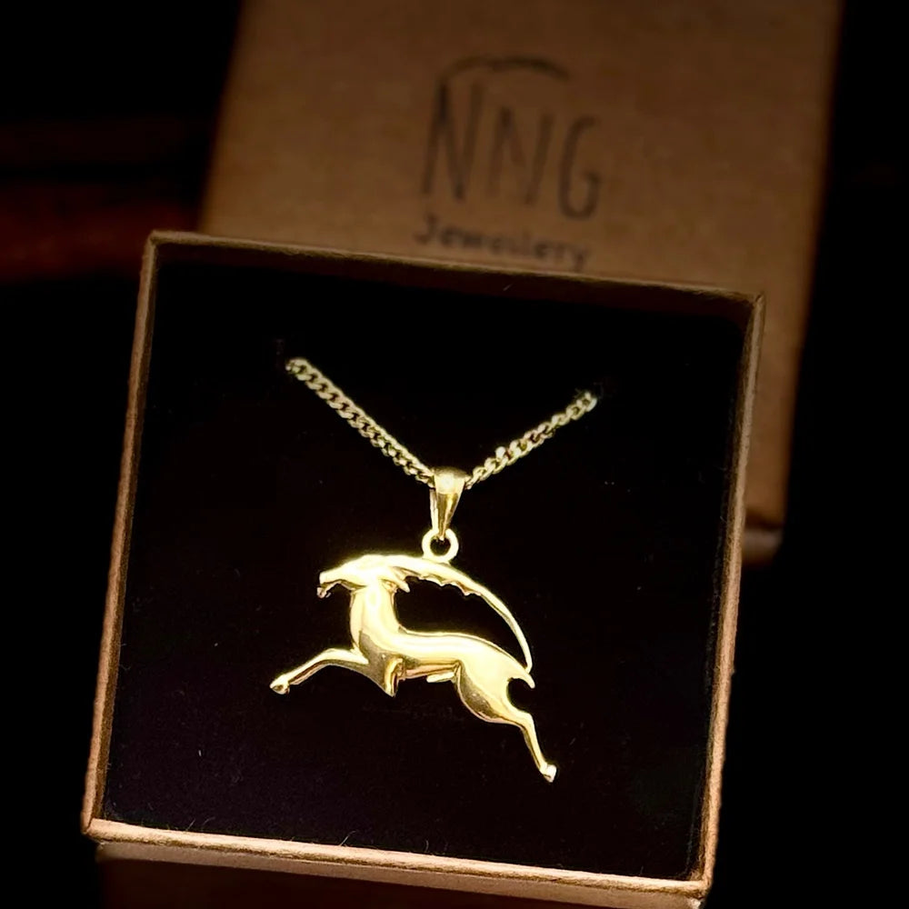 Golden goat pendant necklace on a delicate chain, perfect for women seeking a minimalist, stylish accessory.